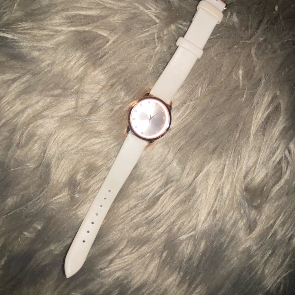 Tan watch with pearl time markers